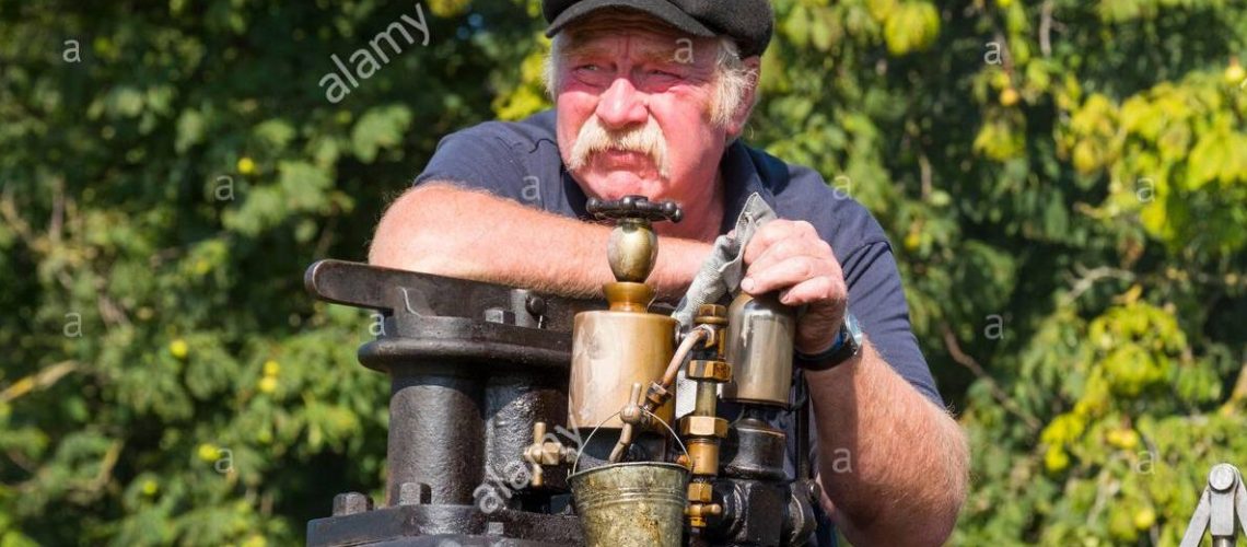 man-polishing-a-steam-engine